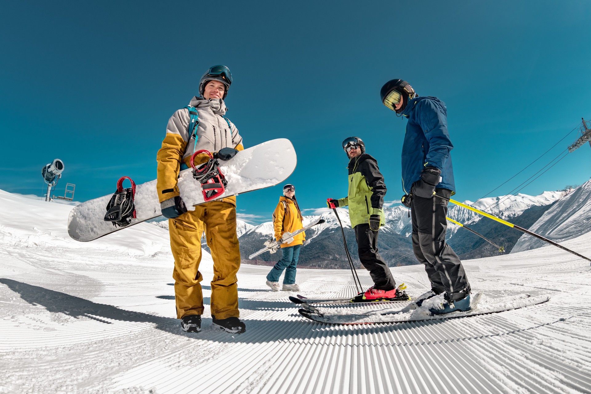 Group of skiers and snowboarders at ski resort